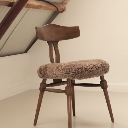 Recrafted dining chair from Design Preowned, restored using wool with circular and sustainable design focus.